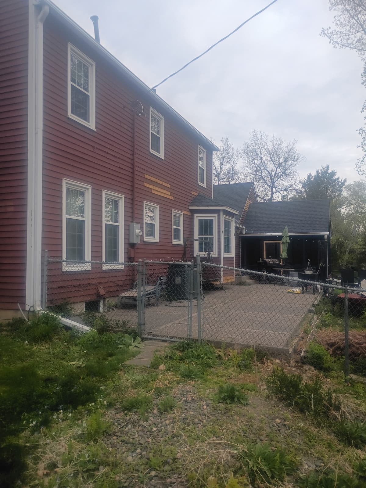 Exterior house before painting — red siding Twin Cities MN